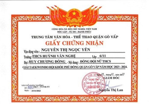 Em Nguyễn Thị Ngọc Yến - Lớp 6/11, được Giám đốc Trung tâm Văn hóa - Thể thao quận Gò Vấp tặng giấy chứng nhận đạt huy chương Đồng - Nội dung: Đồng đội nữ THCS giải Taekwondo  Hội khỏe Phù Đổng  quận Gò Vấp năm học 2023-2024, ký ngày 25/11/2023